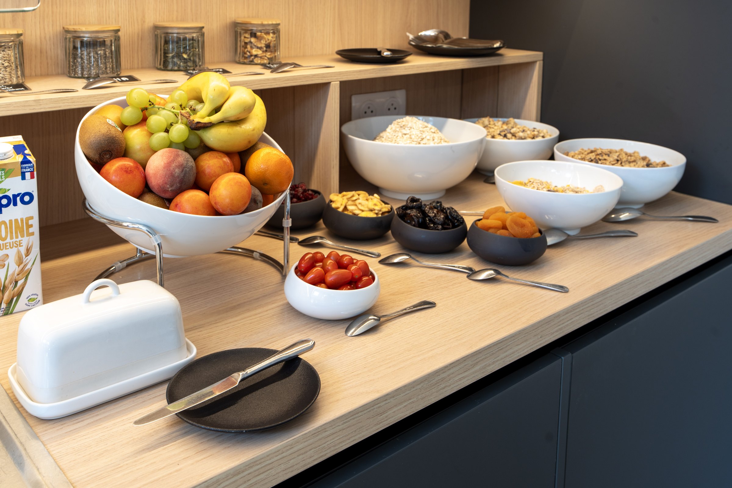 Breakfast buffet with fruit, cereals and dried fruit