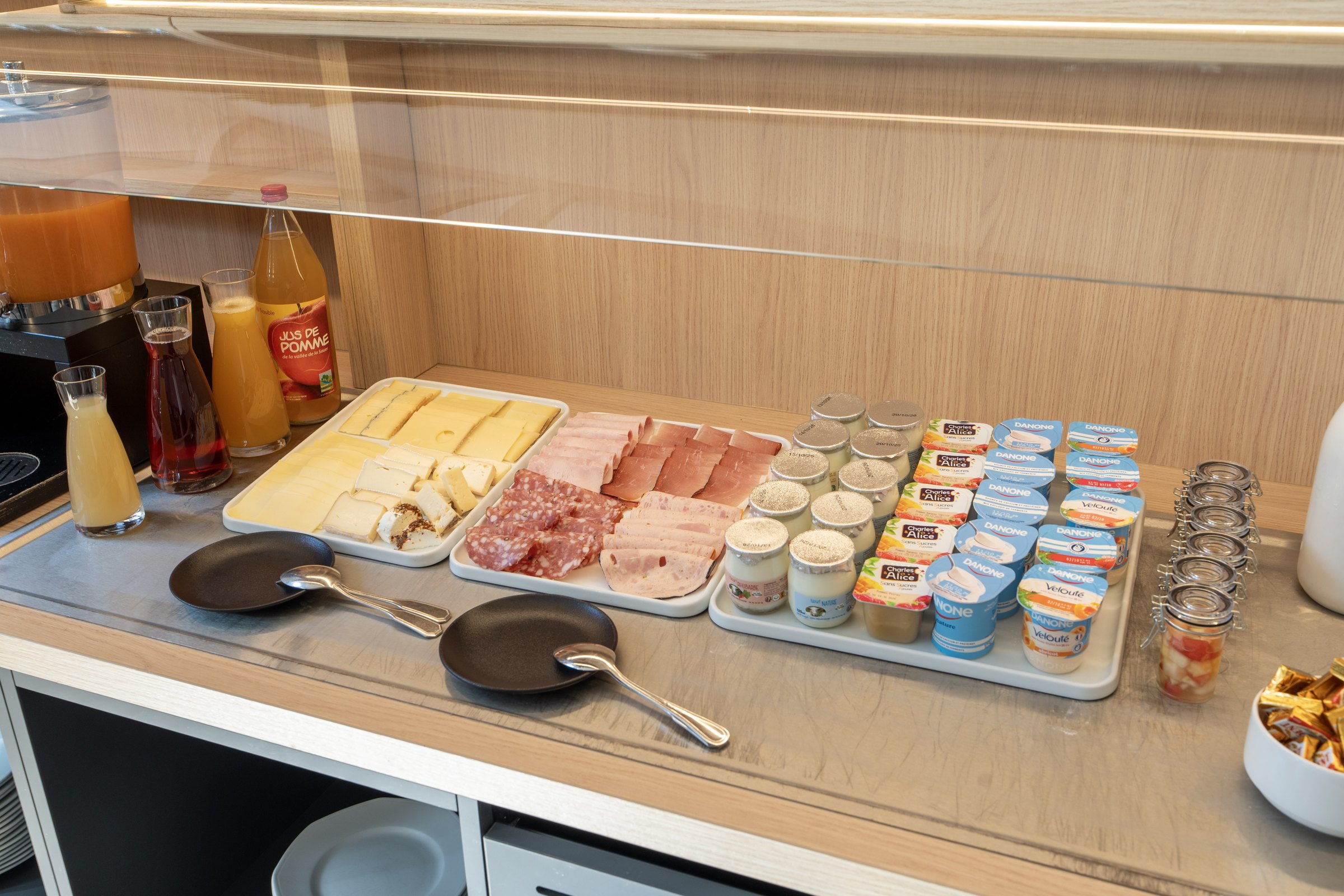Breakfast buffet with cheeses, cold cuts and yoghurt