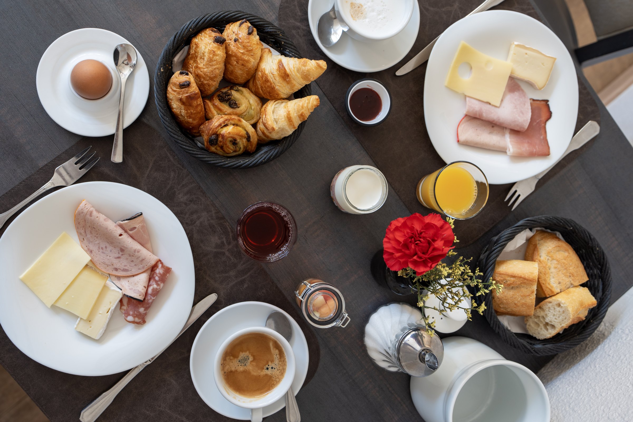Complete breakfast with pastries, coffee, juice, cheese and cold cuts