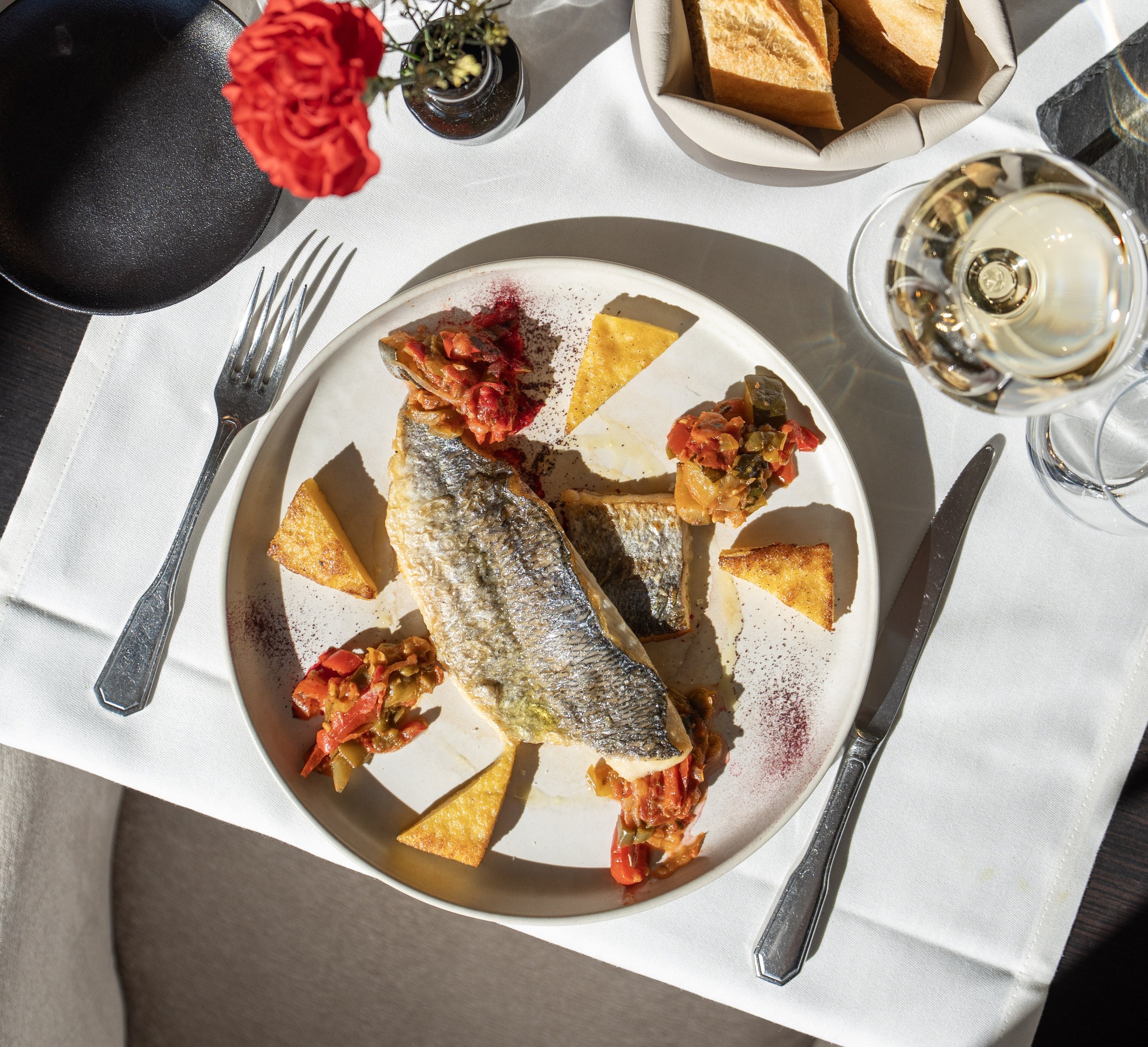 Fish fillets with garnish and lemon