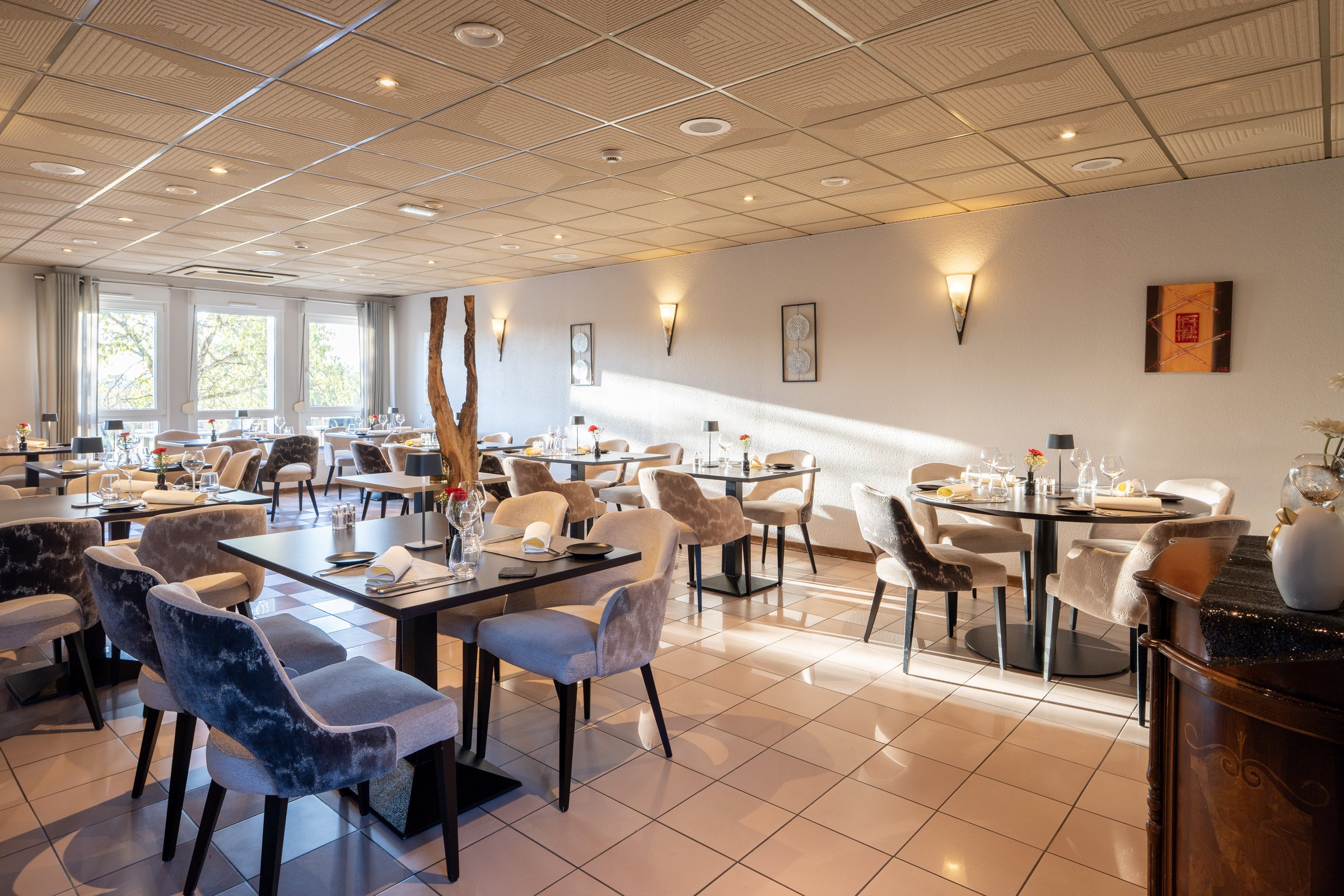 Bright restaurant dining room with tables set for service