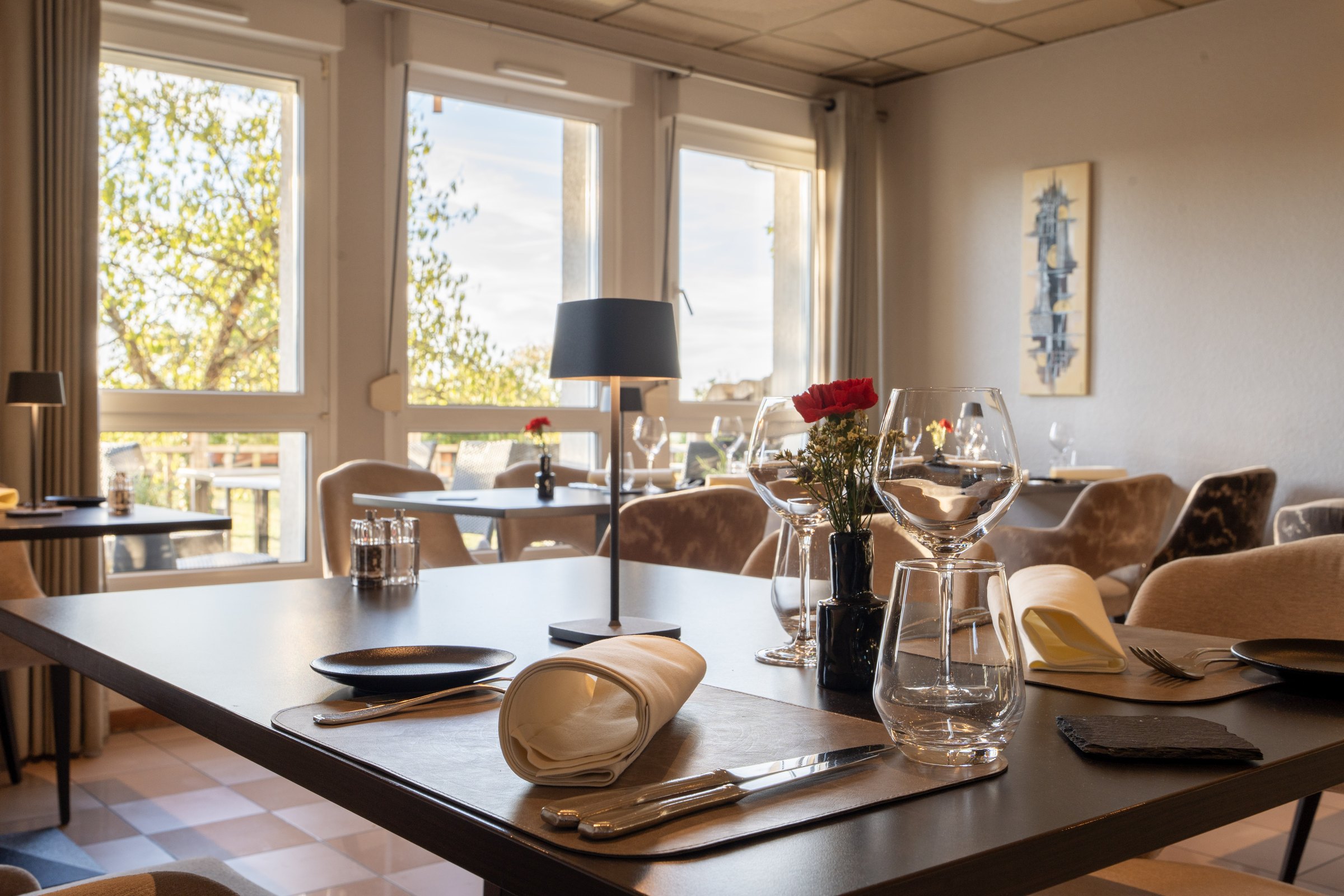 Restaurant table set beside the windows