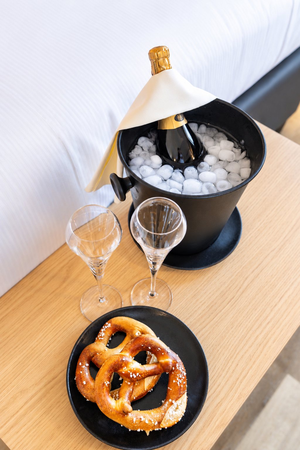 Pretzel, flutes and ice bucket in the room