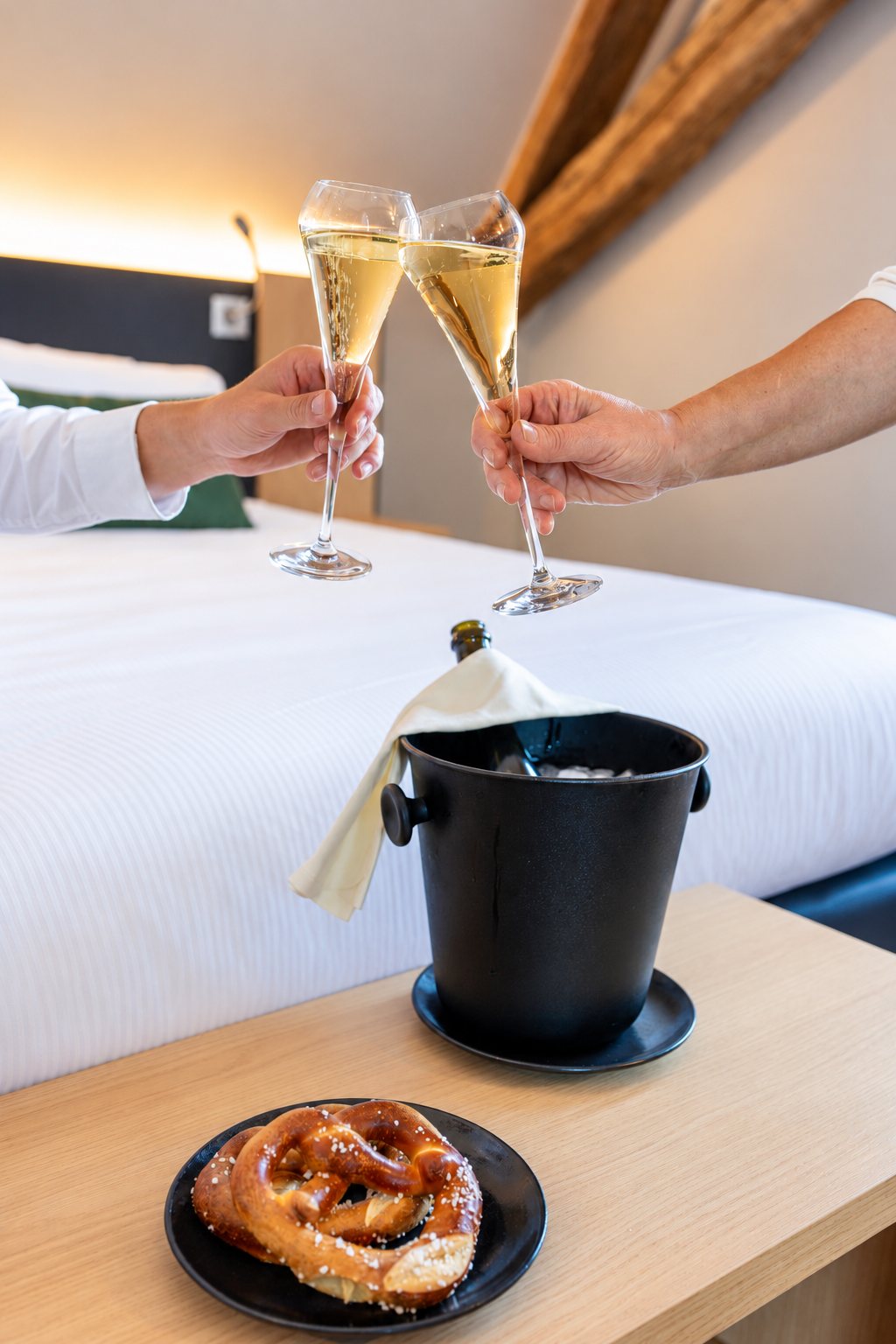Two flutes of sparkling wine raised in a toast